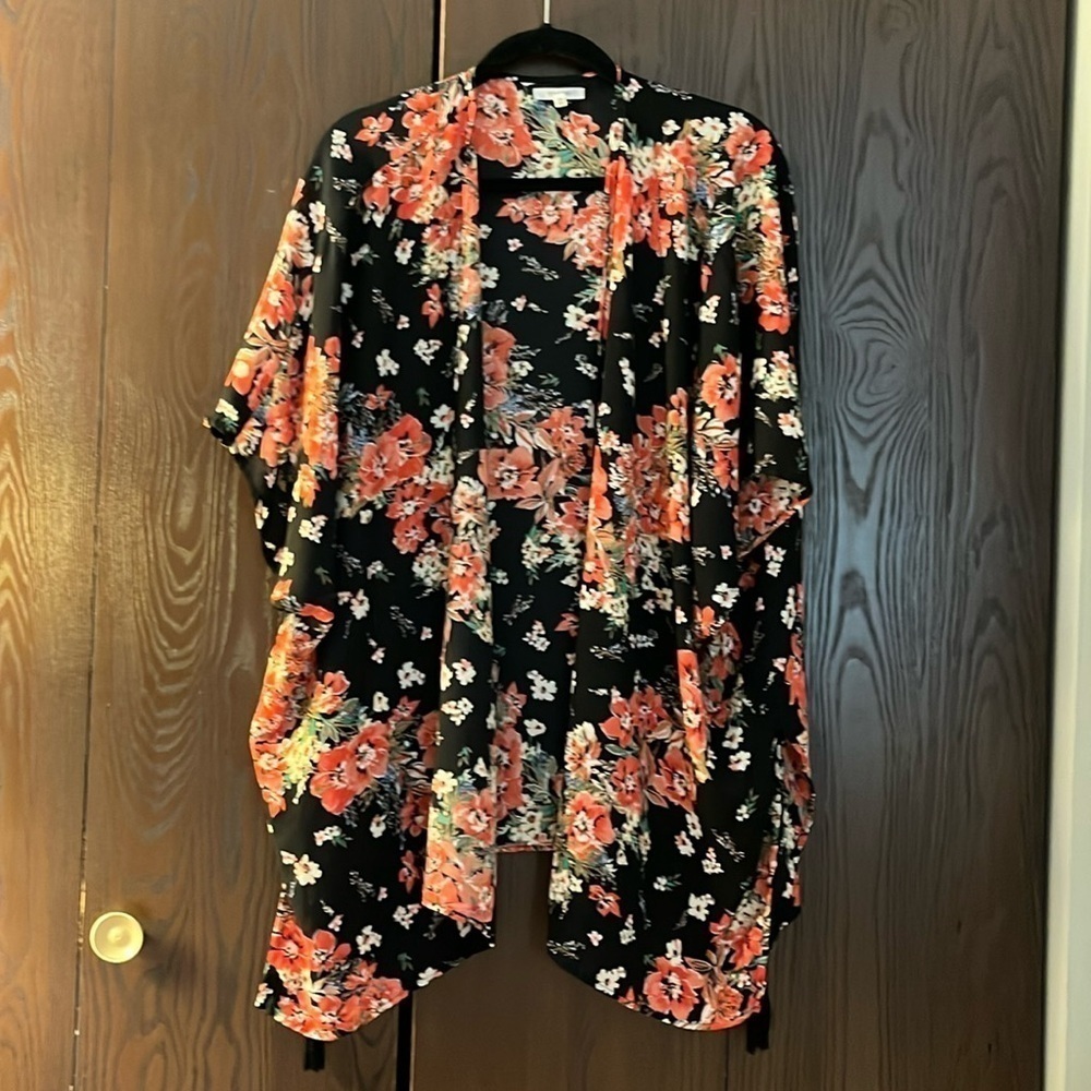 Maurice’s sleeveless black with floral pattern shrug. One size.